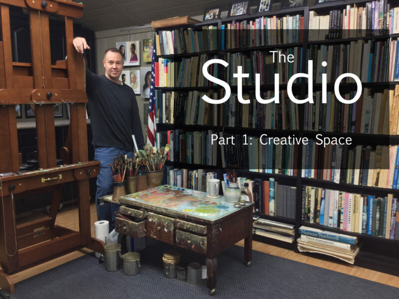 A man standing in front of a book shelf.