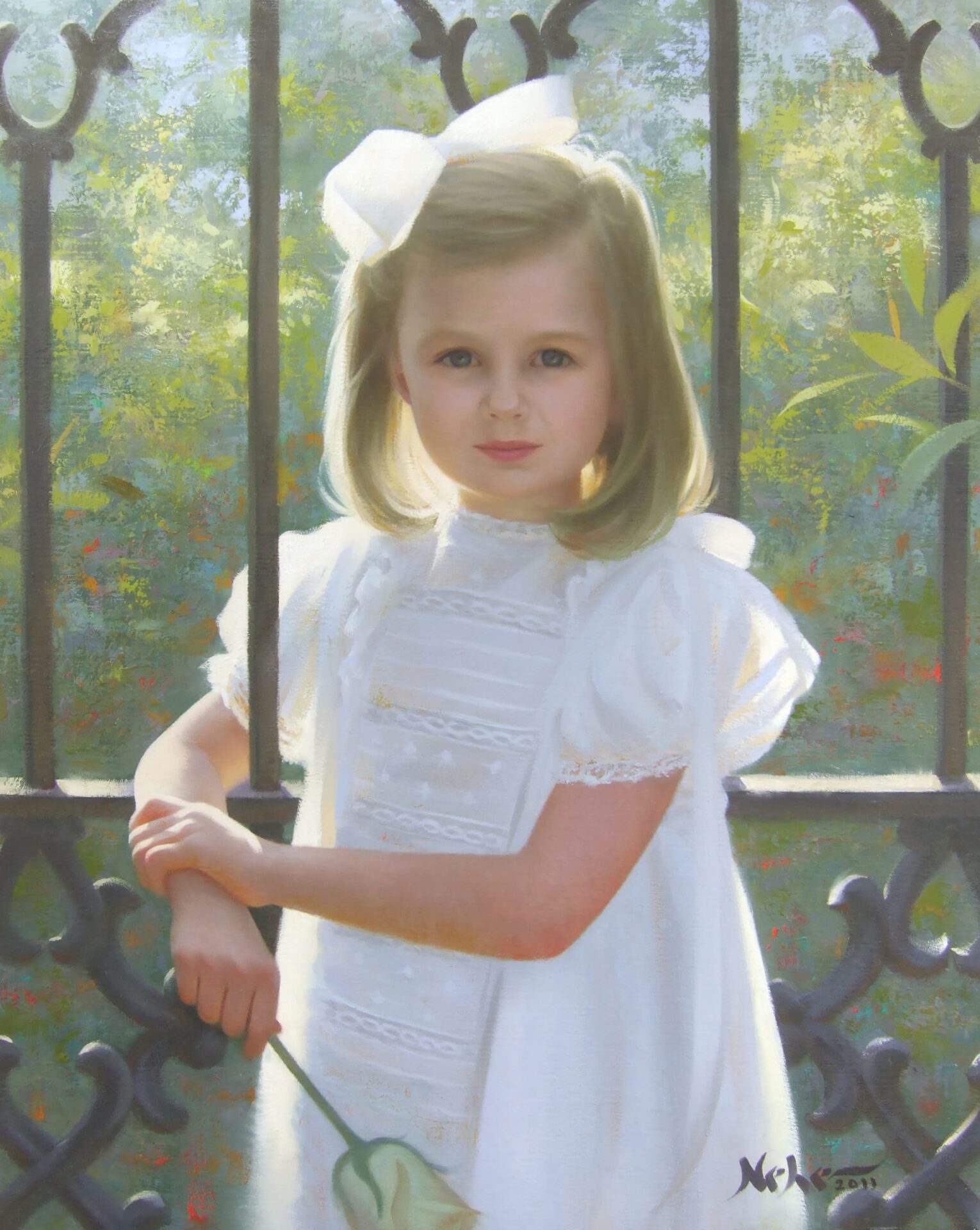 Portrait of a young girl in a white dress