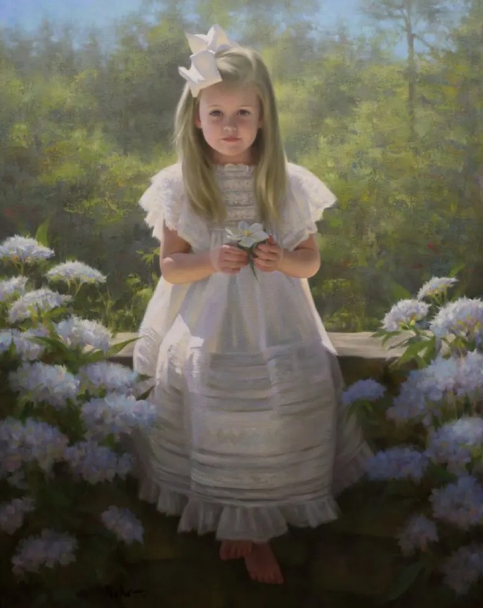 portrait of a little girl wearing white gown